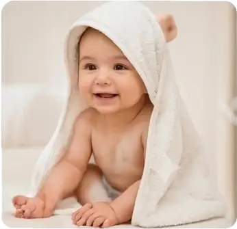 Baby wrapped in towel with hood